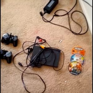 PS2 console with 2 controllers and 3 games